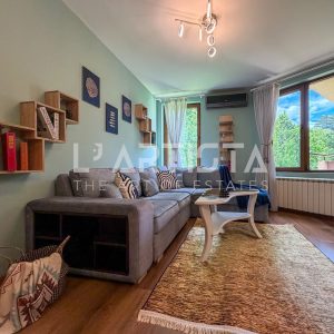 L'Artista presents a fully furnished two-bedroom apartment located in the prestigious and well-maintained gated community "Gloria Palace" in the Gorna Banya 2 neighborhood